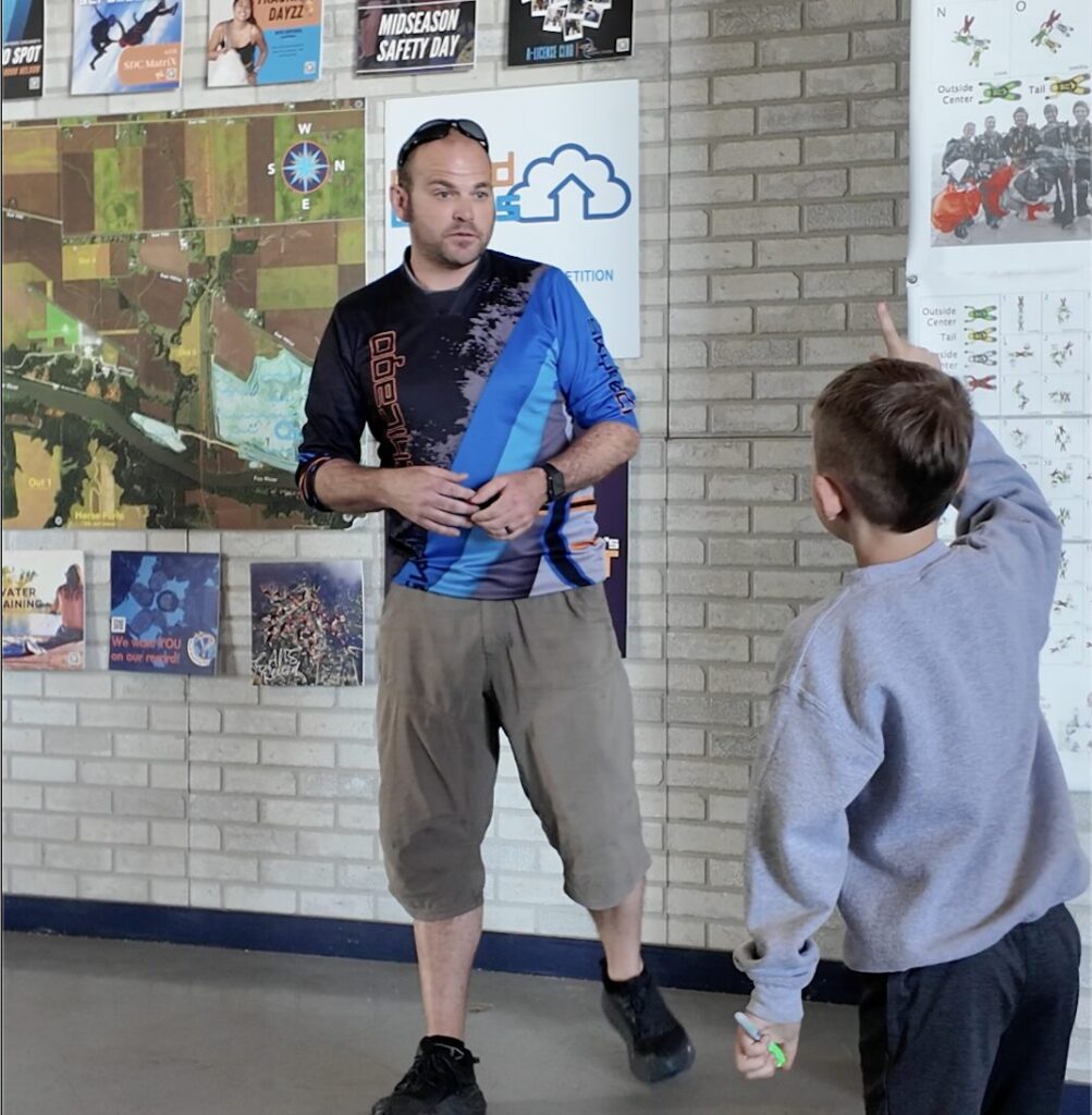 a kid asking questions on the Skydive Chicago spectator tour